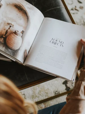woman looking at interior design book